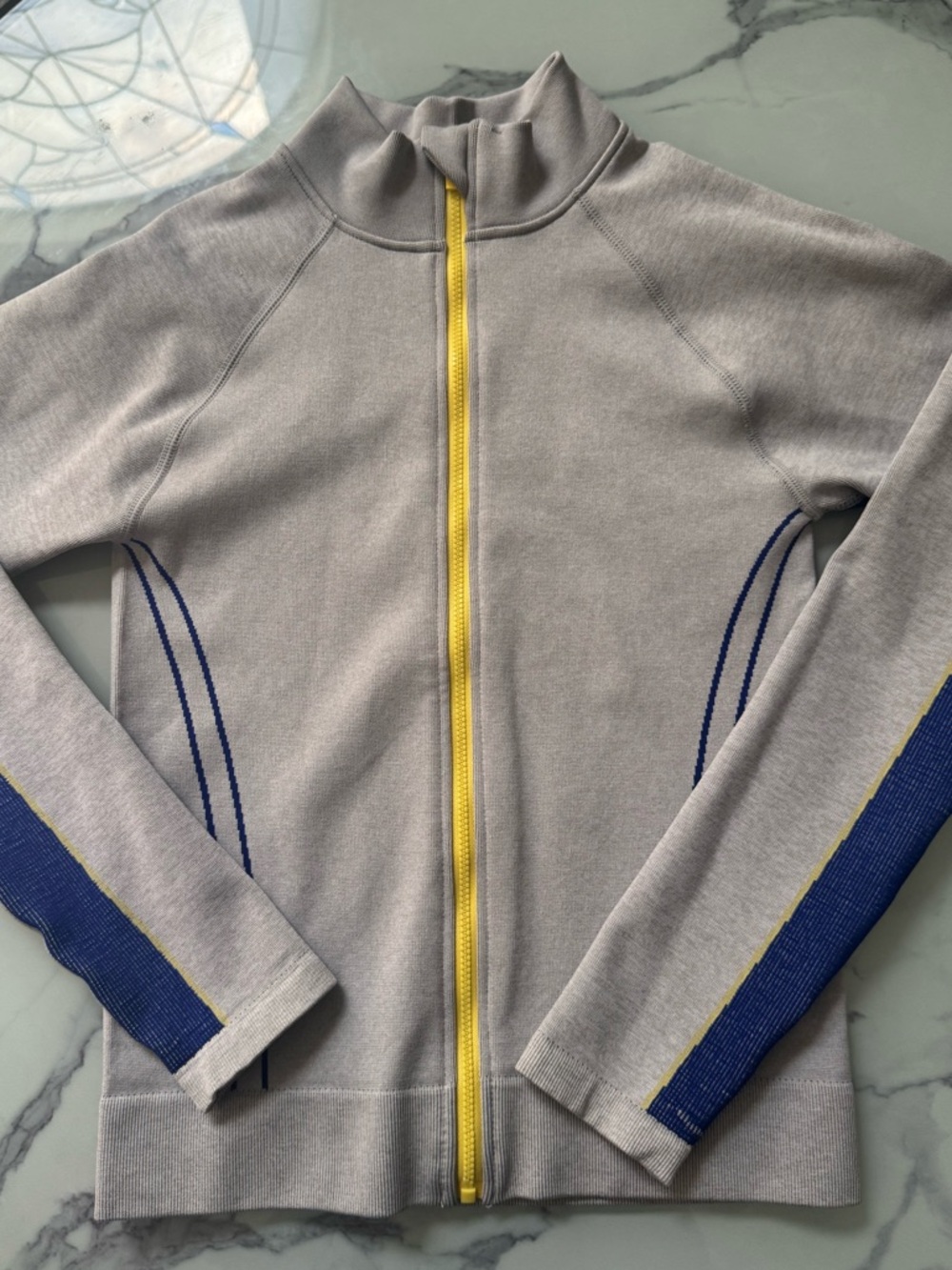 Fabletics Light Gray Zip Jacket with Yellow Zipper and Blue Sleeve Accents